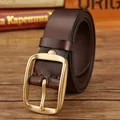 Dark brown leather belt with classic golden metal buckle on rustic wooden surface - 105cm / Coffee