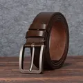 Classic dark brown leather belt for men with vintage silver pin buckle on wooden surface - 105cm / Coffee