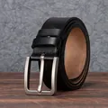 Classic black leather belt for men with silver-tone metal pin buckle on wooden surface - 105cm / Black