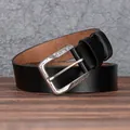 Men's retro black leather belt with ornate silver alloy buckle on wooden surface - 105cm / Black