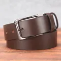 Classic men's brown leather belt with gunmetal needle buckle on a rustic wooden surface - 105cm / Coffee