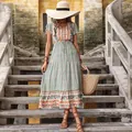 Bohemian paisley print maxi dress in teal and orange with V-neck and tiered skirt - S / Green