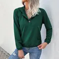 Deep green hooded sweatshirt with buttoned neckline and ribbed cuffs on model - S / Dark Green
