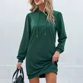 Deep green long sleeve hooded mini dress with drawstring and lantern sleeves on a model - XL / Dark Green