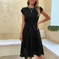 Elegant sleeveless pleated dress for women in pure black with waist tie detail - Black