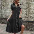 Women's black short sleeve shirt dress with gold buttons and tiered ruffle hemline - S / Black