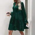 Detail of elegant V-neck velvet dress showing tiered ruffle hem and premium fabric texture - S / Dark Green