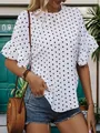 Detail van witte blouse met polkadots, gelaagde ruchesmouwen en een ronde halslijn - S / Wit