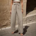 Pantaloni beige a gamba larga plissettati a vita alta con cintura a fiocco e volant - Taglia S / Kaki