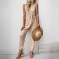 Elegant beige sleeveless jumpsuit with wrap V-neck and waist tie for summer fashion - S / Apricot