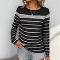 Camiseta de mujer de manga larga con rayas clásicas en blanco y negro y bloques de color - S / Negro