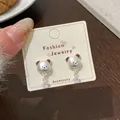 Orecchini a perno a forma di orso argento con dettagli marroni e zirconi a stella - KFT4 Stella Orso Zirconia