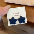 Elegant navy blue flocked star stud earrings with velvet texture on jewelry card - Blue Star (ZRW21)