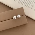Minimalist small white round pearl stud earrings with soft luster in jewelry display - Silver Brushed Round Bead Stud Earrings