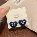 Deep blue flocked heart stud earrings with silver bow detail on jewelry card - Blue Heart Bowknot (AXW46)
