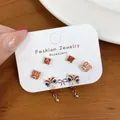 Three-piece Chinese style earring set with red tassels, guardian lion, and lucky characters - LIN7 Good Luck Lion Dance Stud Earrings Set