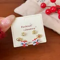 Three-pair Chinese New Year lion dance stud earring set with festive gold and red finish - XST3 Lion Dance Gold Ingot Pouch