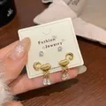 Golden cloud and moon earrings set with zircon teardrop charms on a white display card - Cloud Moon Set / Gold