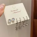 Silver earring set with crystal studs, cute bear pendants and bell charms on card - Bear Bell Style