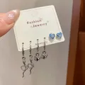 Three-pair silver earring set with snake and heart charms plus blue crystal studs - Blue Zircon Silver Snake Style
