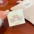 Elegant silver butterfly earrings with pink cat eye stones displayed on fashion card - Light Pink Cat Eye Butterfly Style (NV1)