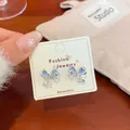 Silver butterfly earrings with blue enamel and sparkling crystals on card - Blue Bowknot Style (HDJW011)