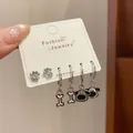 Three-pair silver earring set featuring cute dog paw, bone, and cartoon puppy charms - Dog And Bone Style