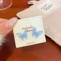 Elegant light blue cat eye butterfly stud earrings with delicate hollow wing design - Blue Butterfly Style (HDF1)
