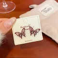 Elegant butterfly stud earrings with burgundy frame and lilac cat-eye stones - Red Butterfly Cat Eye Stone Style (HDF3)