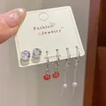 Three-pair silver earring set with red Persimmon charms, crystals and pearl drops - Zircon Persimmon Heart Style