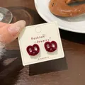 Red flocked heart stud earrings with vintage velvet texture on a jewelry card - HSR03 Red Flocked Pretzel Knot