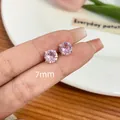 Elegant 7mm pink round-cut zircon stud earring with a silver-tone four-prong setting - Screw Back Style / 7mm / Pink