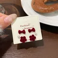 Red flocked bow and flower earring set with pearls on beige jewelry card - 3 Pairs Set / HSR07 Pearl Flower Bowtie Style