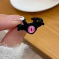 Quirky black plush monster ring featuring a vibrant purple and pink gradient eyeball - Black Wing Flocking Monster Ring