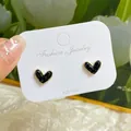 Elegant heart-shaped black stud earrings with gold trim on 925 silver posts - Black Heart Crystal