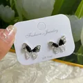 Elegant 925 silver butterfly stud earrings featuring black and white crystals - Black Hollow Crystal Butterfly