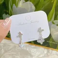 Elegant 925 silver post earrings featuring light blue marble effect butterfly wings - Double Butterfly Crystal