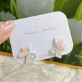 Pink gradient crystal butterfly stud earrings with silver pins on a jewelry card - Peach Orange Butterfly Crystal