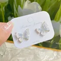 Exquisite blue gradient crystal butterfly earrings with 925 silver posts on display - Micro-Inlaid Blue Crystal Butterfly