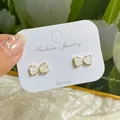Elegant gold-tone bow stud earrings with white crystal inlay and 925 silver posts - White Bowknot Crystal