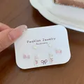 Ohrstecker-Set mit drei Paaren in Rosa: Schmetterling, Hase und Herzmotive - Rosa Zirkonia Häschen Set
