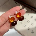 Vintage amber and brown beaded stud earrings with a minimalist three-color stacked design - Meillard Brown Beads