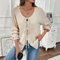 Women's cream knit cardigan featuring stylish front bow ties and loose casual fit - S / Apricot