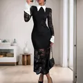Elegant lace dress with contrast white collar and cuffs in a slim black silhouette - S / Black