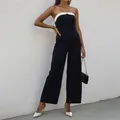 Ärmelloser schwarz-weißer trägerloser Jumpsuit mit weitem Bein und hoher Taille - XL / Schwarz