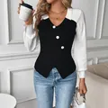 Slim fit V-neck ribbed knit sweater in black and white color block with decorative buttons - S / Black & White