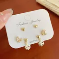 Three-pair earring set featuring gold hearts, pearls, and red polka dot heart charms - White Heart Pendant Polka Dot (BN6)