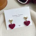 Elegant burgundy velvet heart earrings with gold-toned metal studs on display - Red Heart Pendant (RV18)