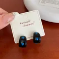Polished black hoop earrings with blue heart patterns on a fashion jewelry display card - Blue Heart Hoop Polka Dot (BN14)
