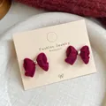 Elegant wine red velvet bow earrings with gold center on a white jewelry display card - Double Layer Bowknot (WJ5)